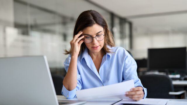 woman reading bill