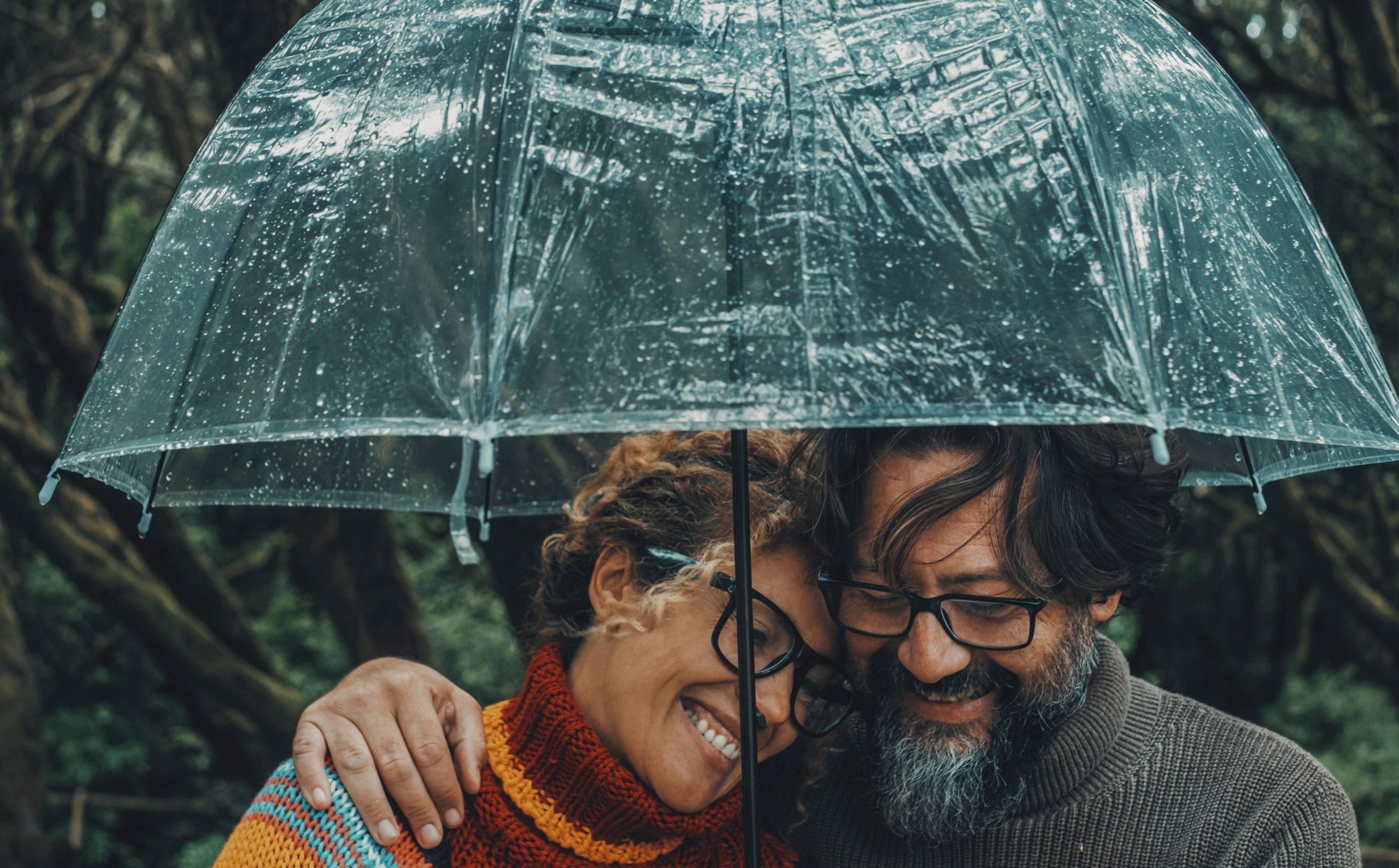 A couple under an umbrella.