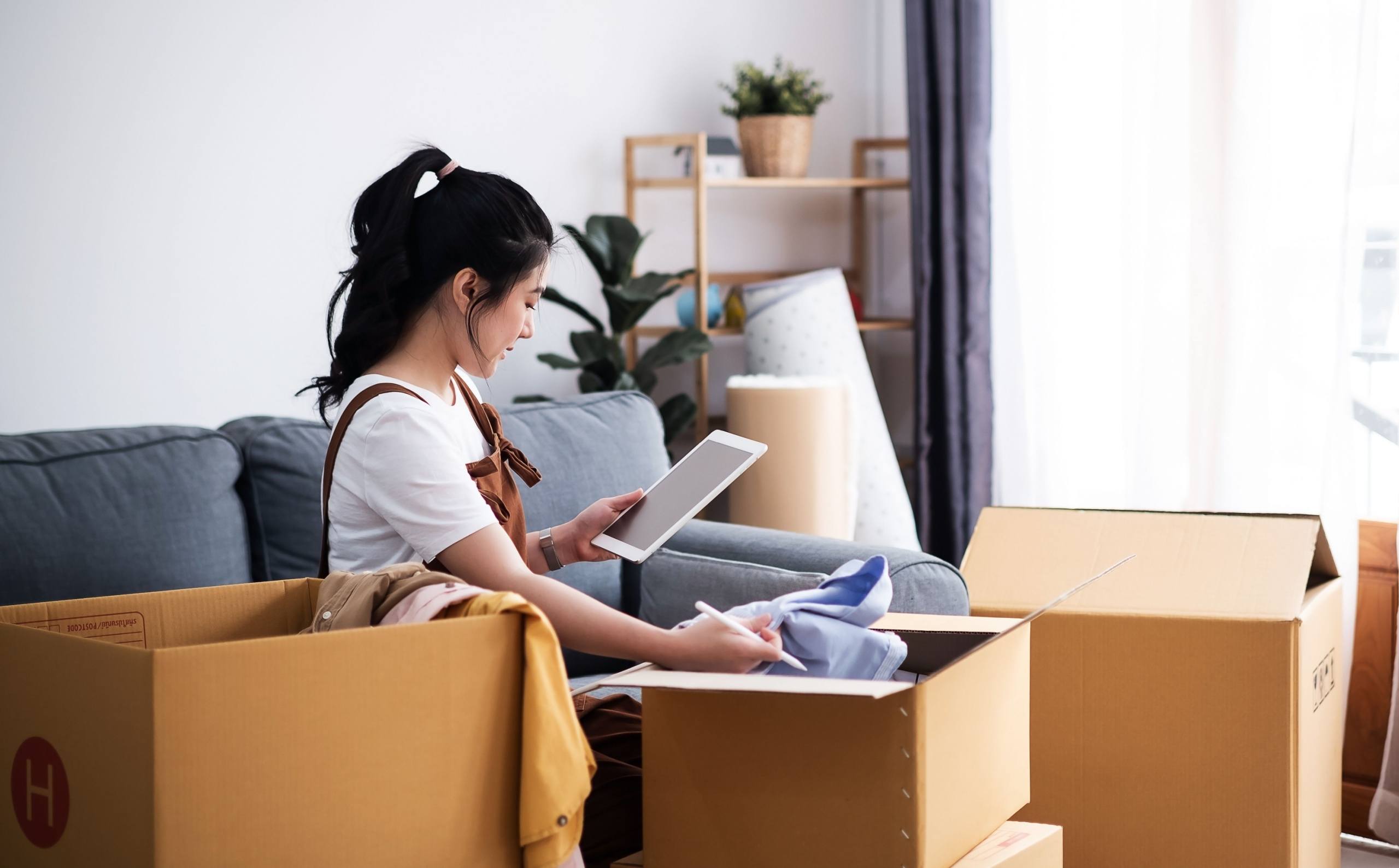 young woman moving into her first home