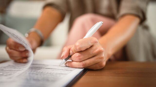 woman signing document